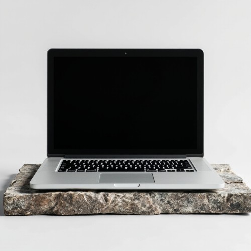 Silver-Laptop-on-Stone-Slab-with-Black-Screen_IJ9wK